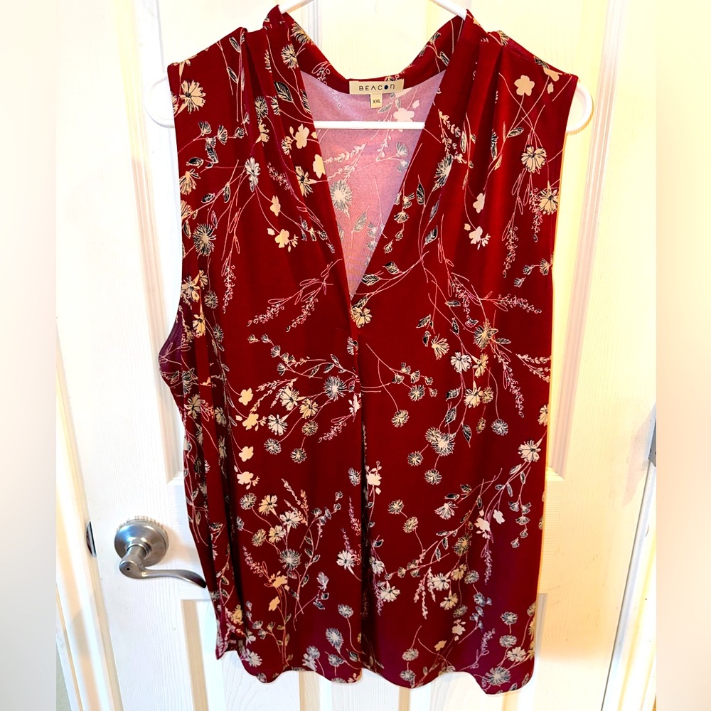 Burgundy sleeveless blouse with cute floral detail